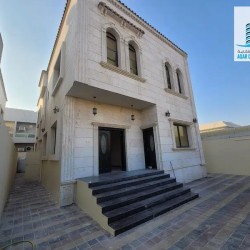 Villa for rent in Ajman, Al Rawda 3 area The second row of Sheikh Ammar Street It consists of two floors Stone facade 5 master rooms council Lounge Ex-pic_1