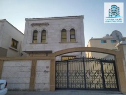 Villa for rent in Ajman, Al Rawda 3 area The second row of Sheikh Ammar Street It consists of two floors Stone facade 5 master rooms council Lounge Ex-image