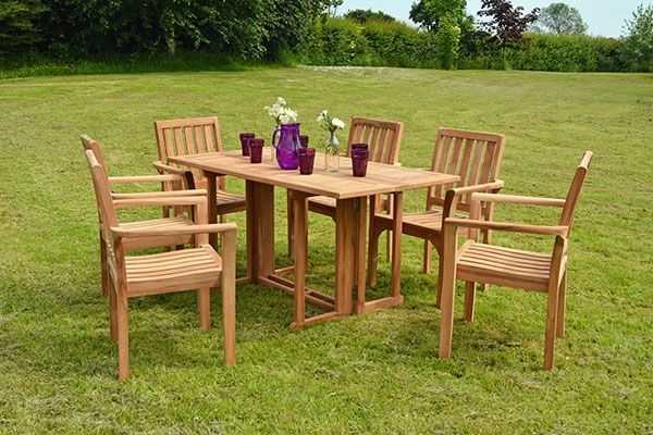 An amazing garden seater with chairs and wooden table