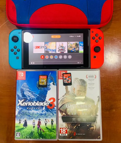Nitendo switch with 4 games and travel bag